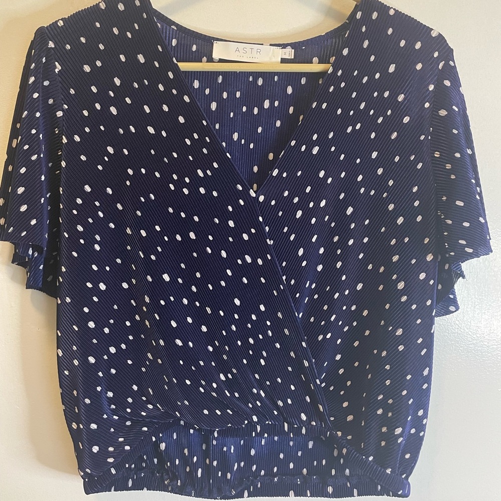 ASTR navy blue ribbed knit blouse. Has little white polka dots.